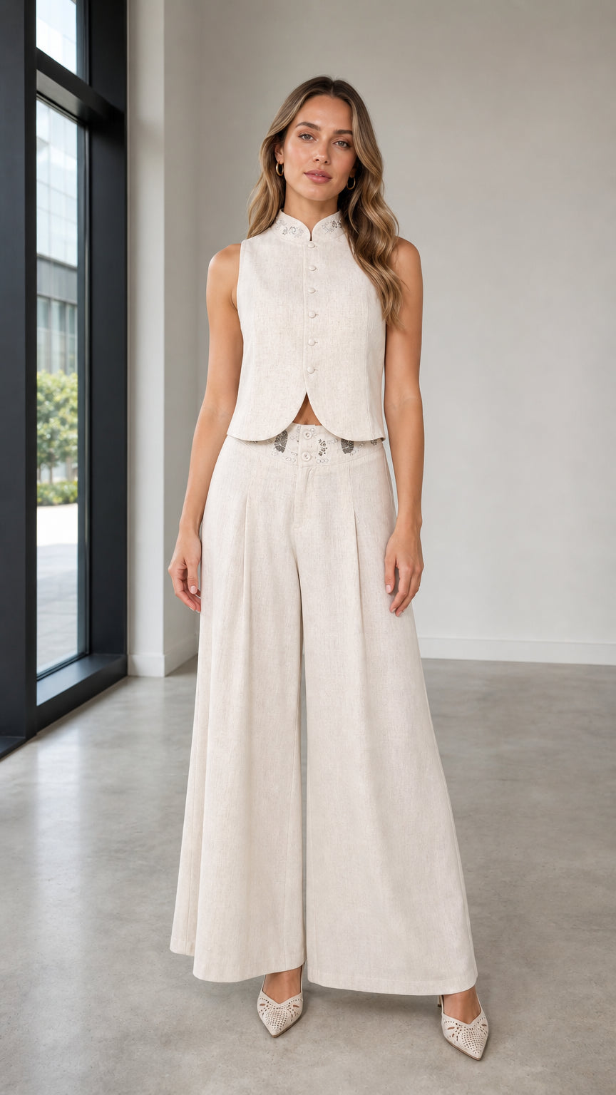 Front view of woman wearing beige sleeveless vest and wide-leg pants set