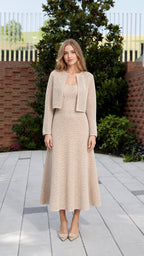 Full front view of model wearing beige knit crop jacket and midi dress set