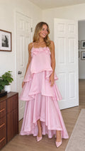 Front view of model wearing pink tiered ruffle cami maxi dress