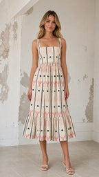 Front view of cream coastal charm embroidered midi dress
