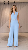 Front view of light blue wide-leg jumpsuit with gold belt