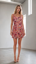 Front full view of model wearing pink floral sequin mini dress