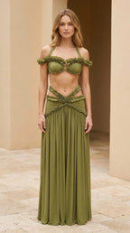 Model wearing olive green ruffled halter two-piece maxi skirt set, front view