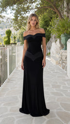 Model wearing black off-the-shoulder evening maxi dress from the front
