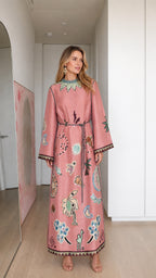 Model wearing pink boho printed long sleeve maxi dress, front view