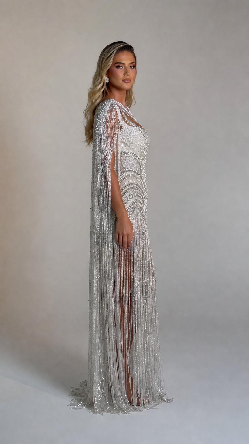 Side profile view of the silver beaded evening gown