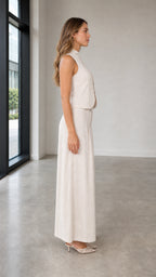 Side profile view of woman wearing beige two-piece set