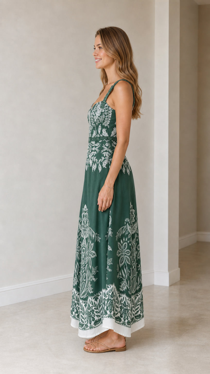 Model wearing green botanical print maxi dress from side