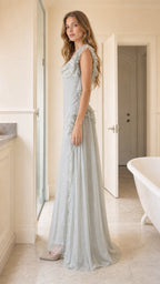 Side profile of model in sage evening gown