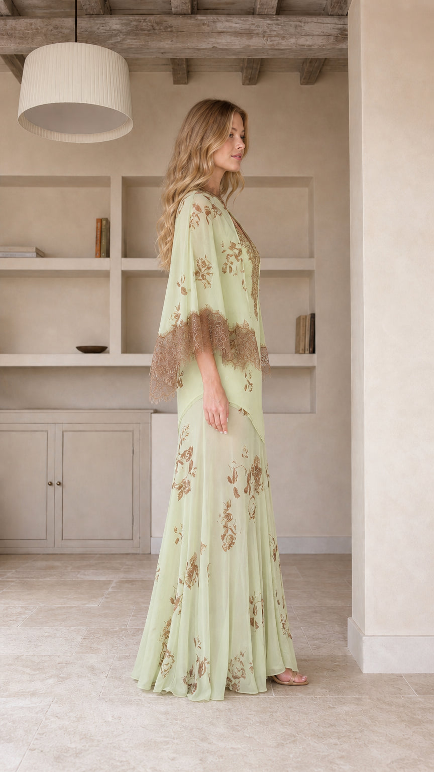 Model wearing mint green floral maxi dress, side profile