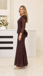 Side profile of woman in dark brown lace mermaid gown