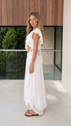 Side profile of model in white two-piece set