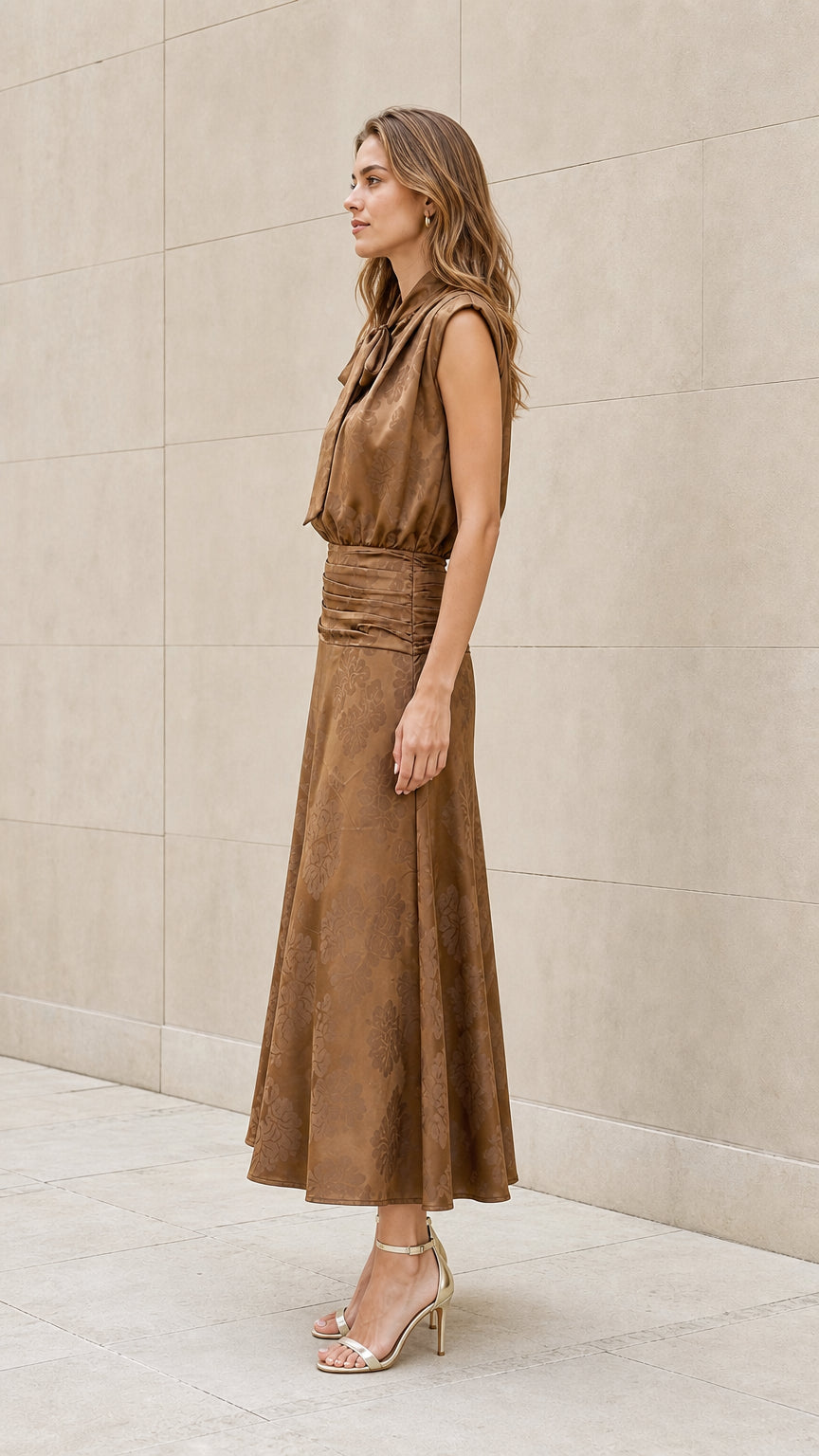 Side view of model wearing brown tie-neck midi dress