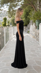 Side profile of model in black evening gown