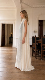 Side profile view of ivory evening dress
