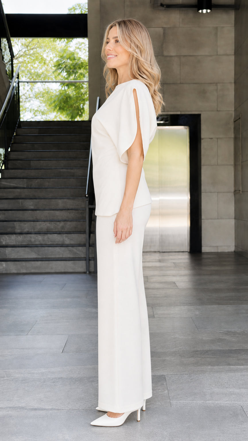 Side view of woman wearing ivory two-piece set