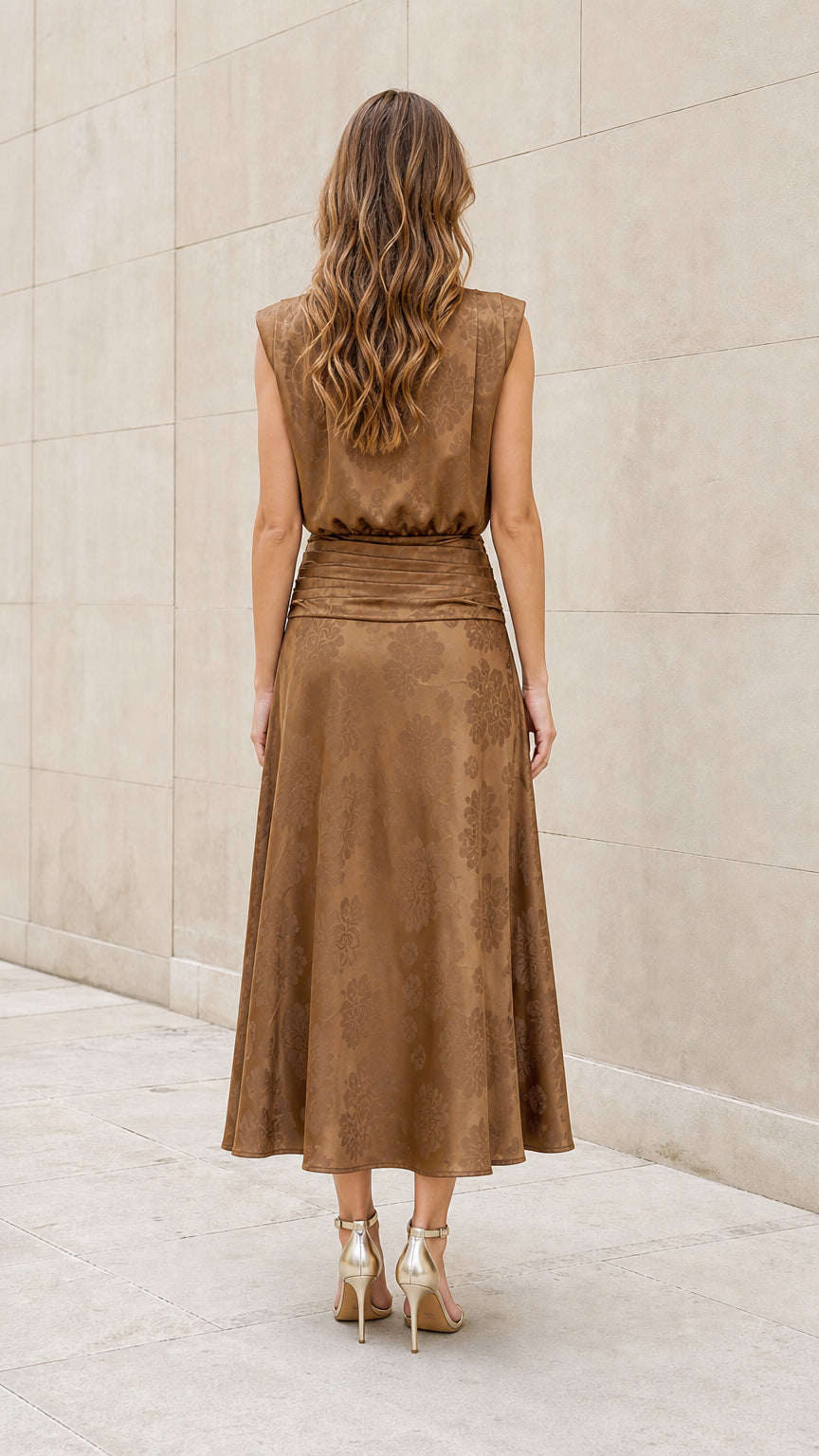 Back view of model wearing brown tie-neck midi dress