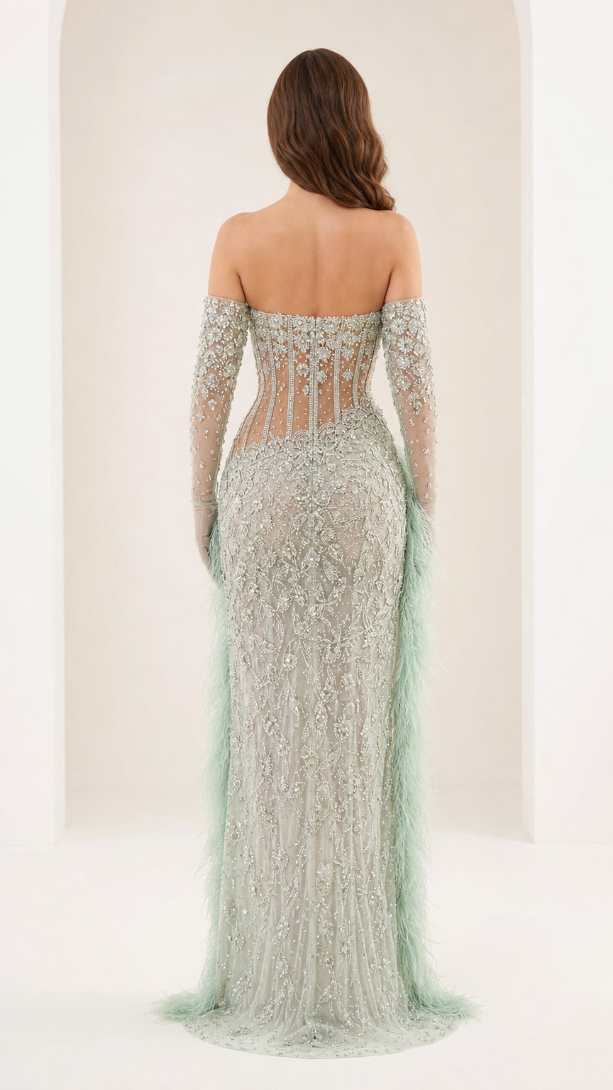 Back view of mint green formal gown with sweep train