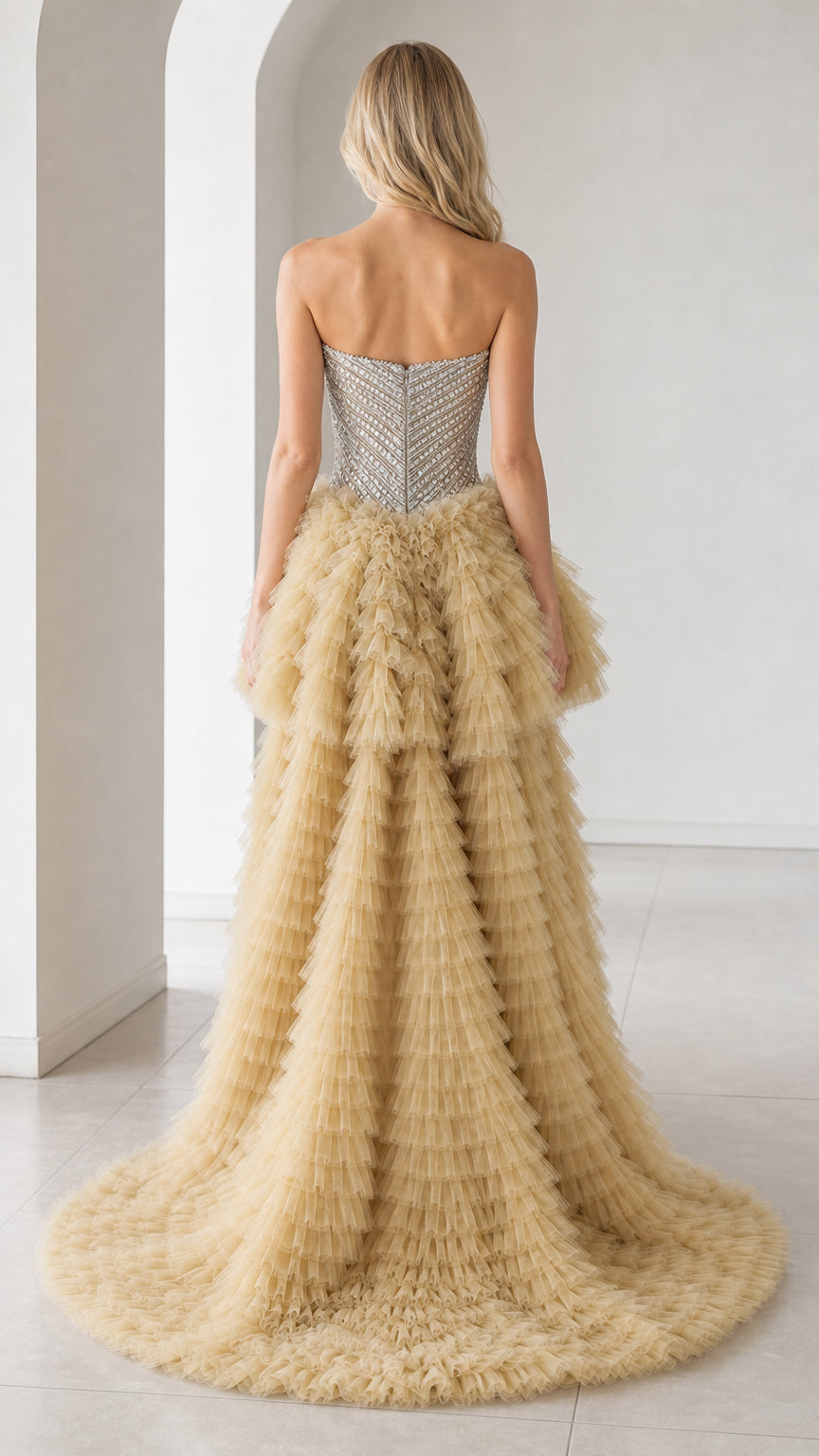 Back view of champagne dress showing long tulle train