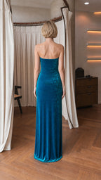 Back view of model in teal velvet gown