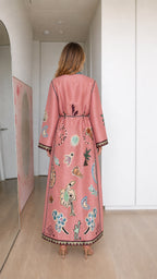 Model wearing pink boho printed long sleeve maxi dress, back view
