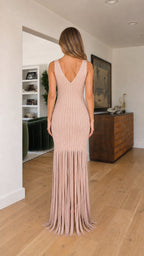 Back view of model in blush maxi dress