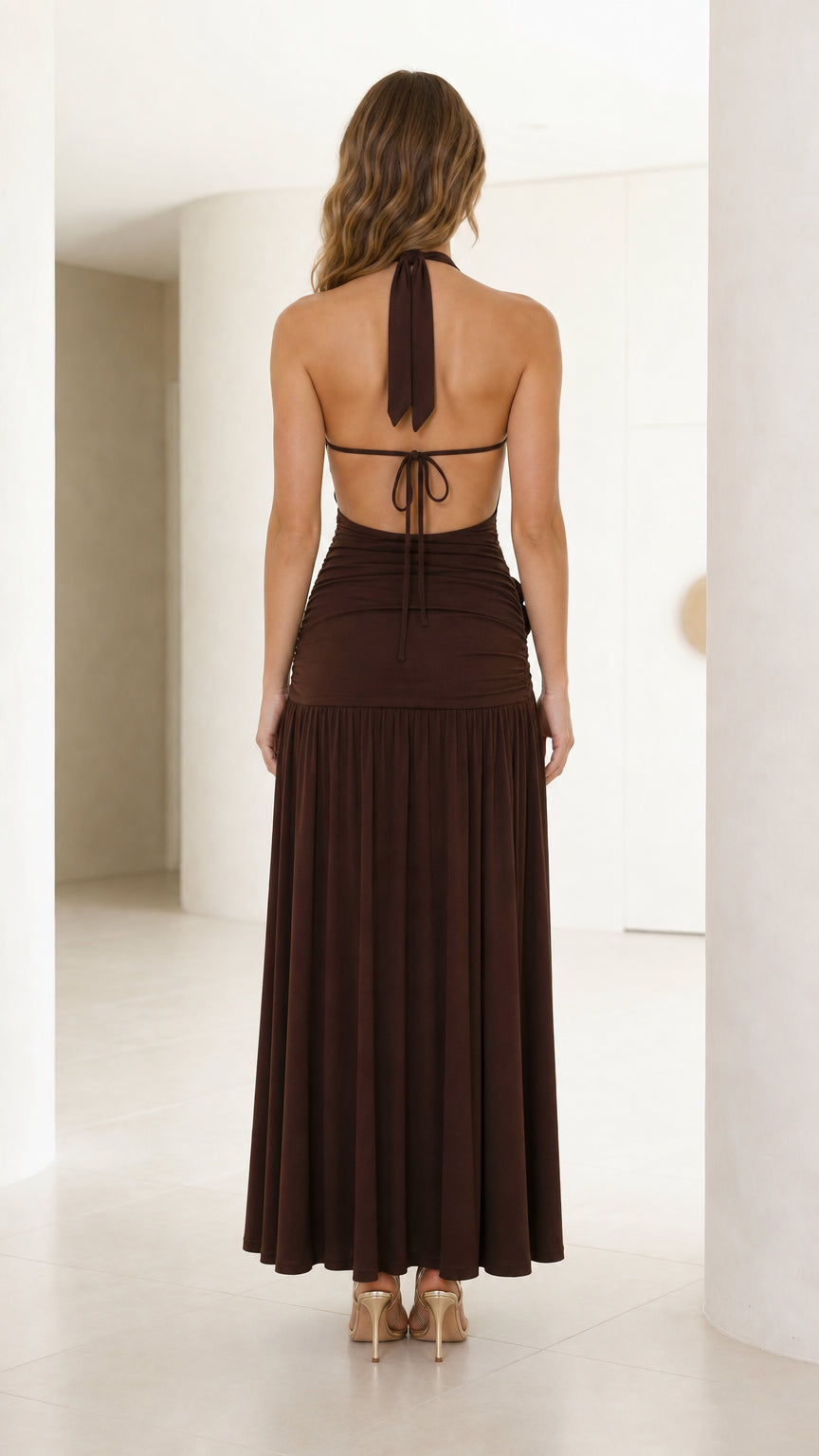 Back view showing open back and tie details of brown dress