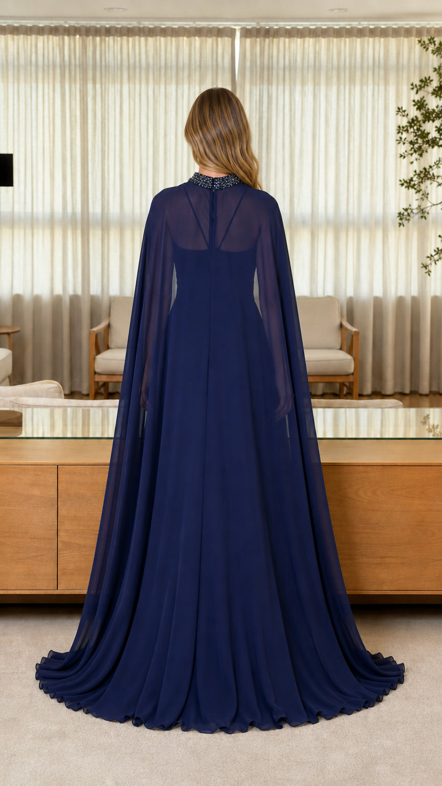 Back view of navy blue evening dress showing flowing cape