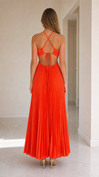 Back view of model showing lace-up open back on orange maxi dress