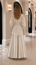 Back view showing fluid drape of champagne wide-leg pants and jacket