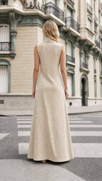Back view of model wearing beige gingham maxi dress
