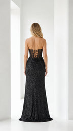Back view of black evening gown showing lace-up corset detail