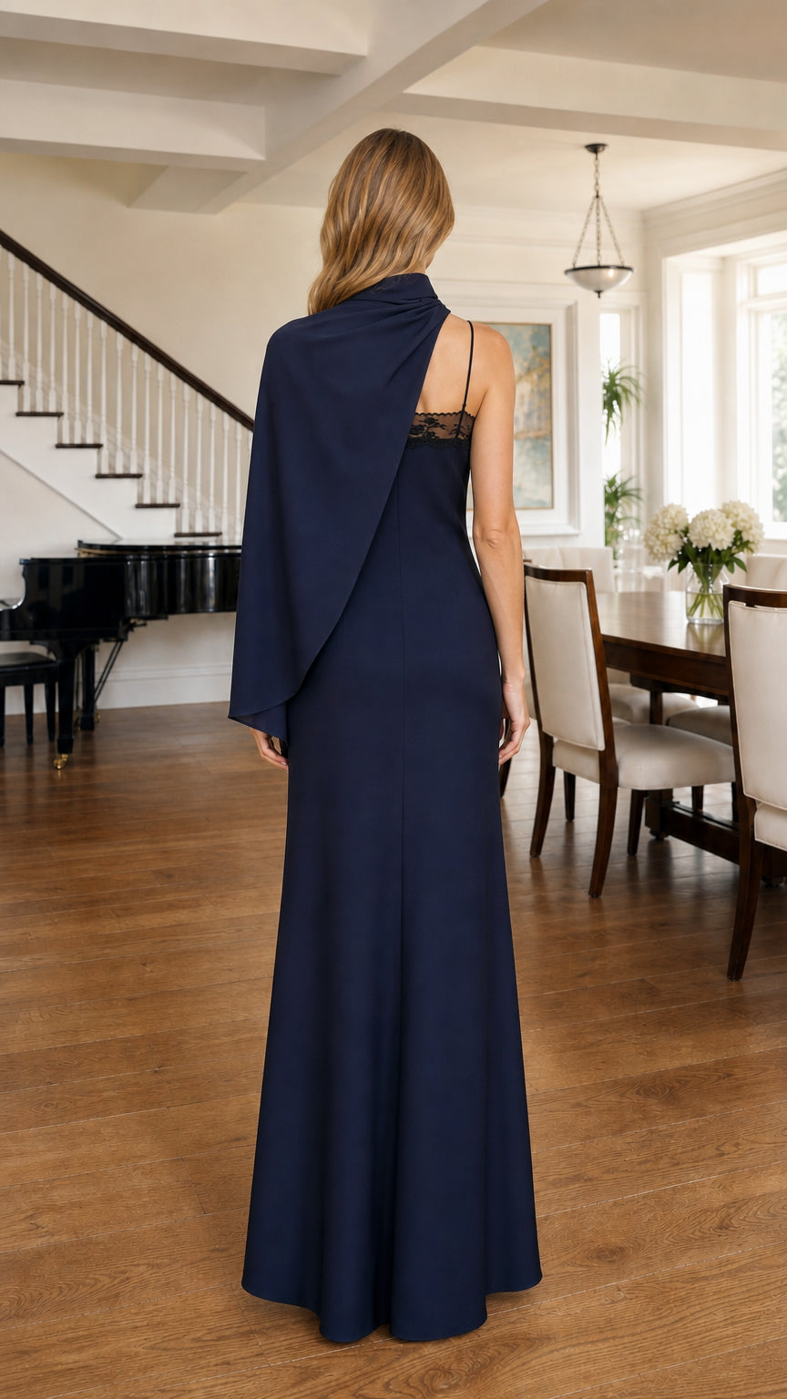 Back view of model in Navy formal dress with cascading shoulder drape
