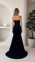 Back view of navy velvet dress with lace-up corset detail
