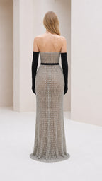 Back view of model in silver glitter strapless evening gown
