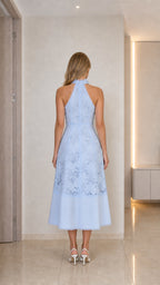 Model wearing light blue lace midi dress back view