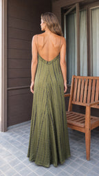 Back view showing open-back detail of olive tie-dye maxi dress