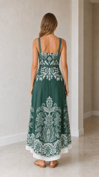 Model wearing green botanical print maxi dress from back