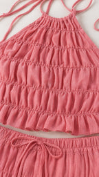 Close up of pink ruched crop top and skirt waistband detail