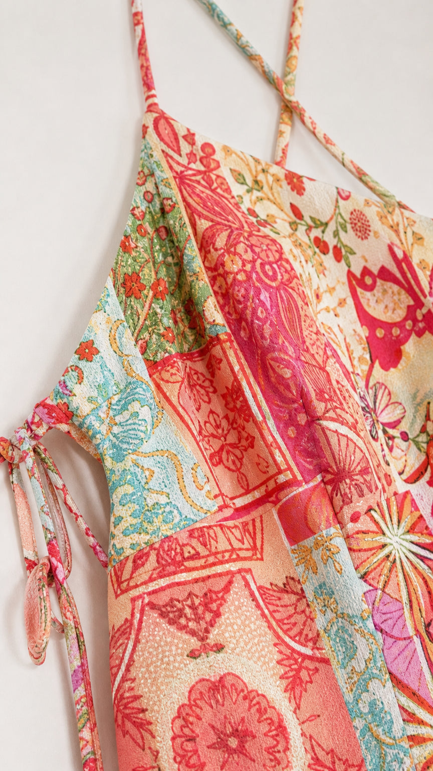 Close-up of fabric print and strap detail on patchwork slip dress