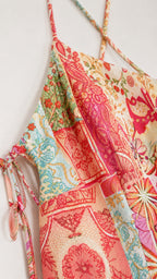 Close-up of fabric print and strap detail on patchwork slip dress