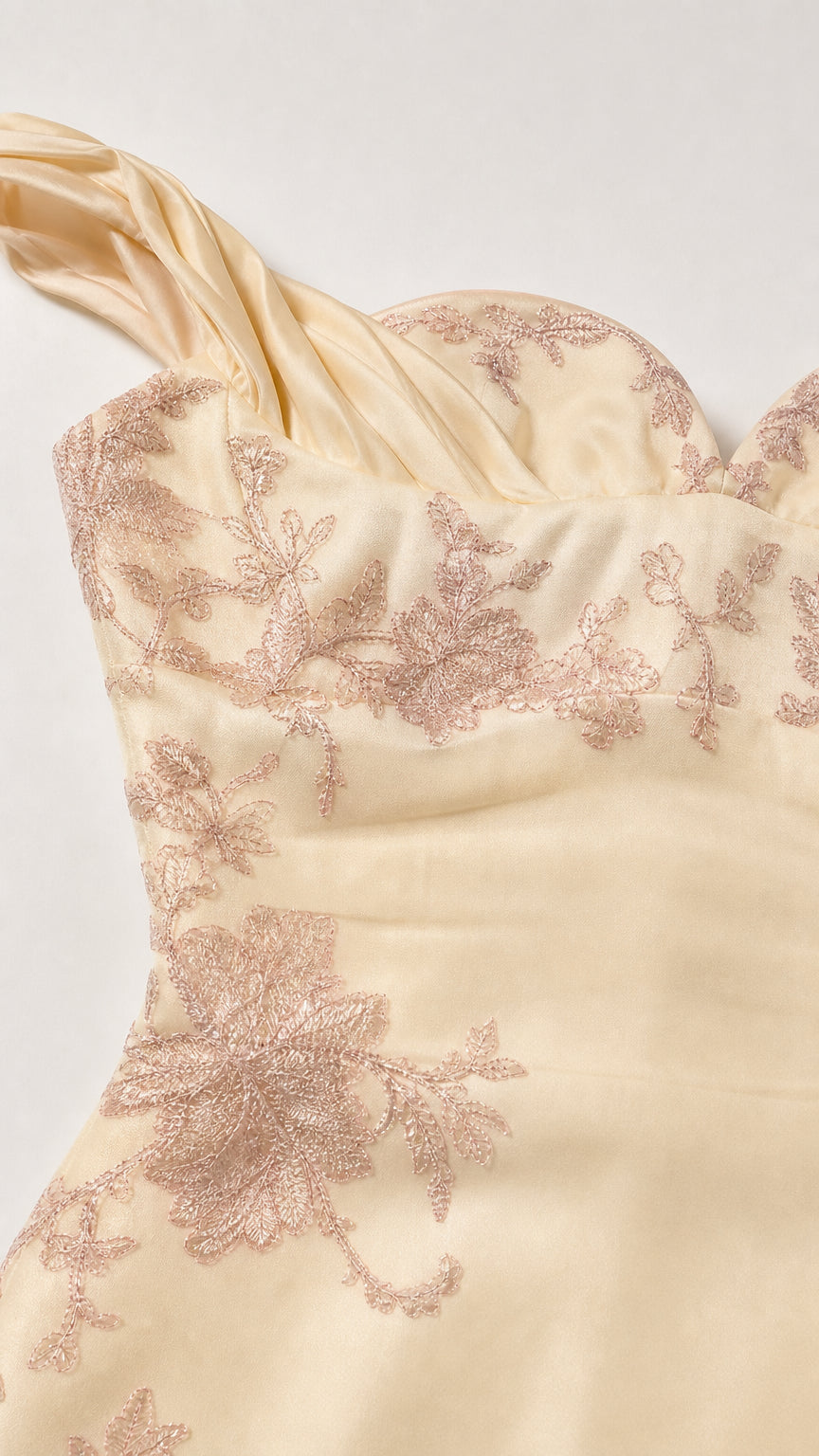 Close-up detail of floral embroidery and sweetheart neckline