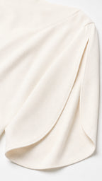 Close-up of smooth ivory fabric and sleeve detail