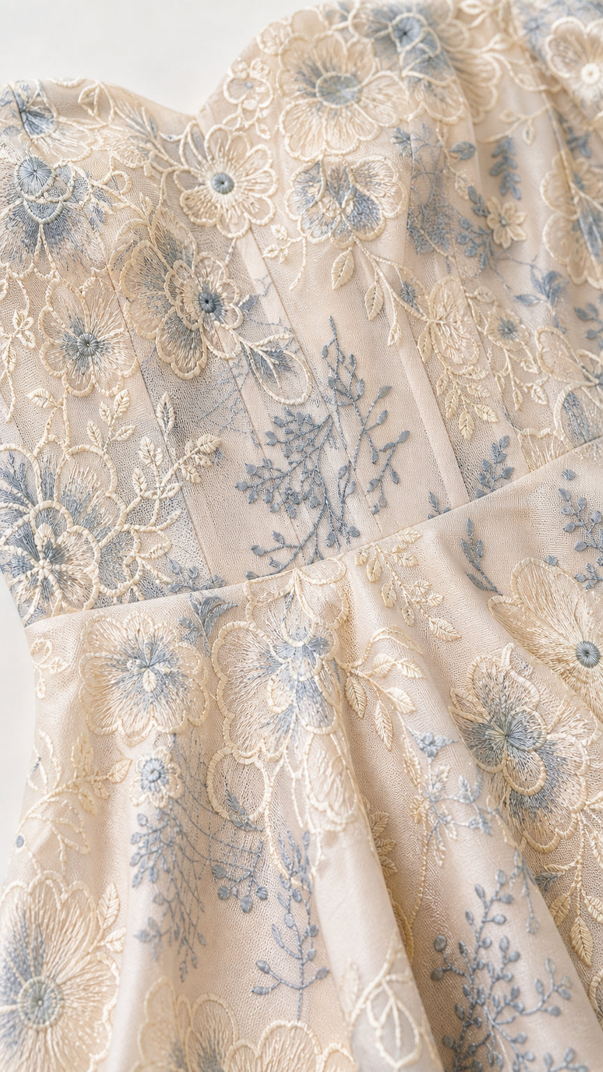 Close-up detail of floral embroidery and sweetheart neckline