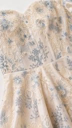 Close-up detail of floral embroidery and sweetheart neckline