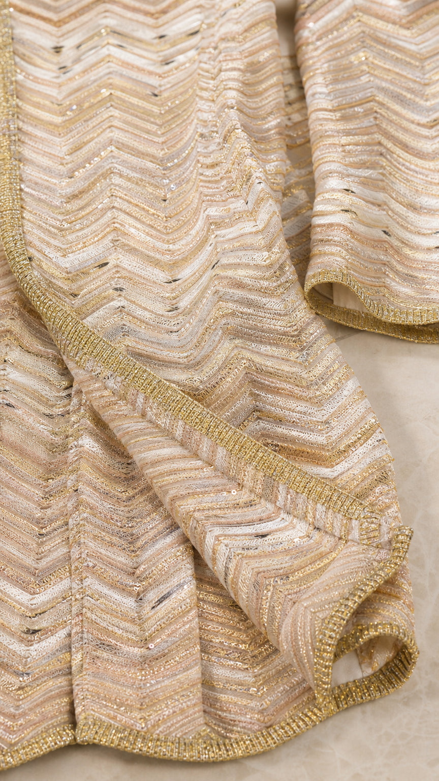 Close-up of metallic chevron knit texture in gold