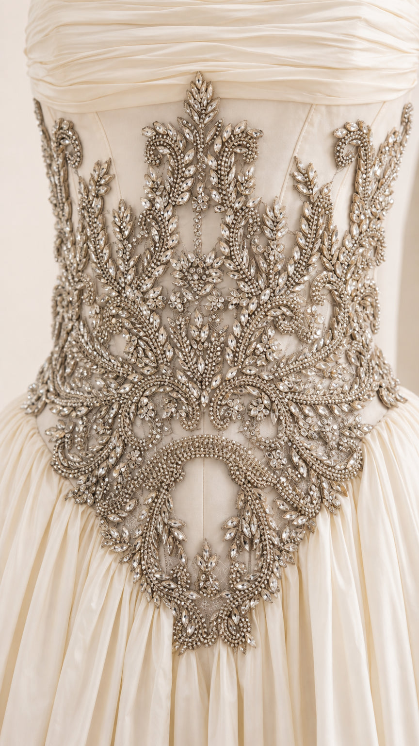 Close-up detail of ornate metallic waist embroidery