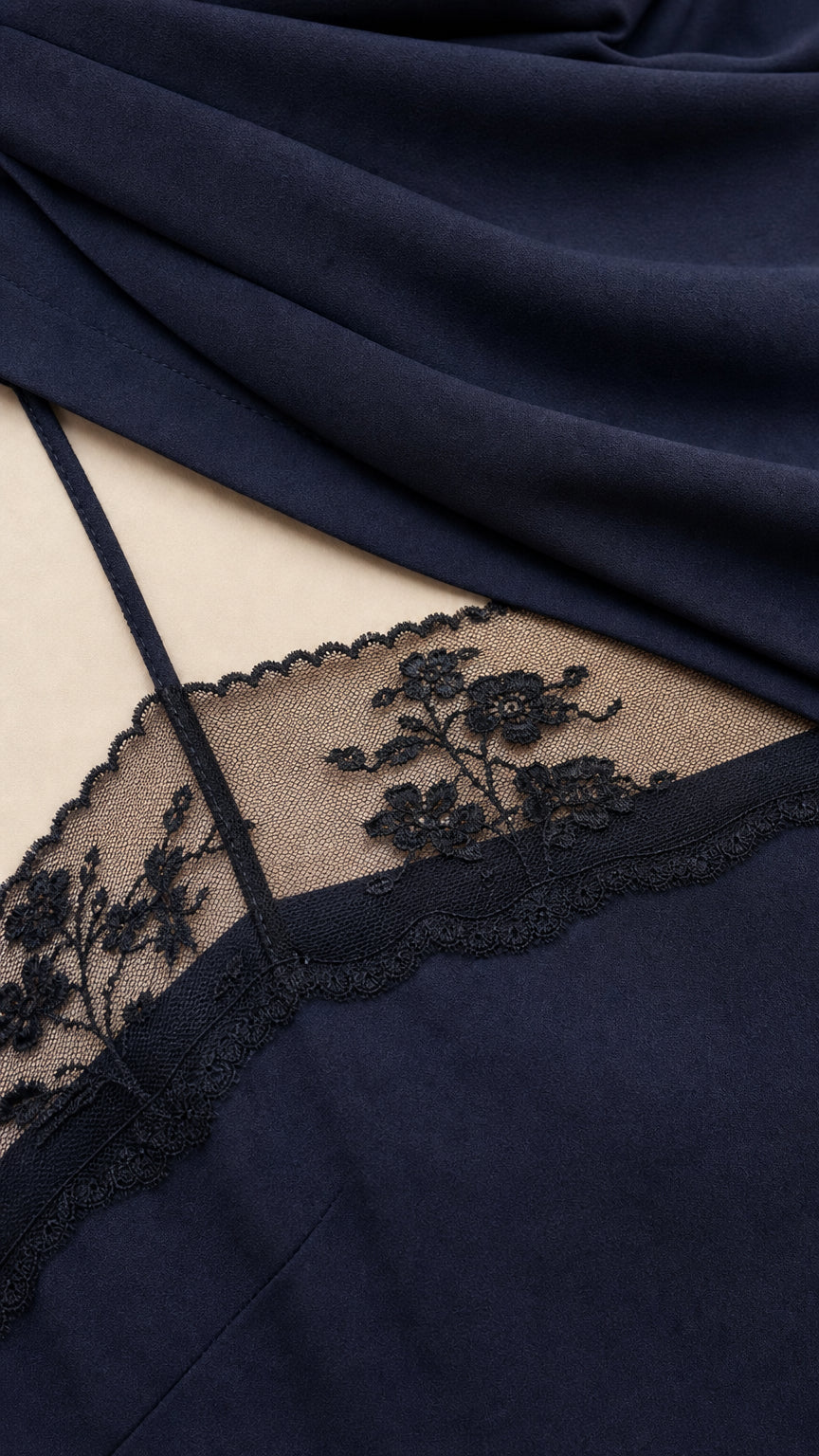 Close-up detail of sheer lace neckline and smooth fabric texture