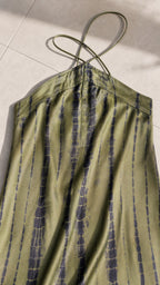 Close-up of halter strap and vertical tie-dye fabric pattern