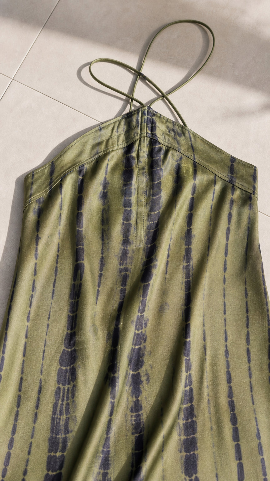 Close-up of halter strap and vertical tie-dye fabric pattern